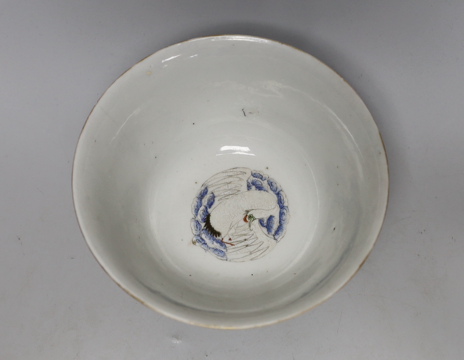 A Chinese 'Thousand Flower' enamelled porcelain bowl, Qianlong mark, early 20th century on hardwood stand, 17cm high